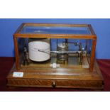 Casella London 560 light oak cased Barograph with single drawer retaining various sheets