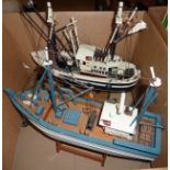 Two wooden model boats