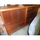 Two sectional three tier open bookcase enclosed by four glazed sliding doors