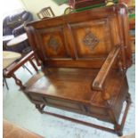 Oak monks bench with carved detail and lift up seat