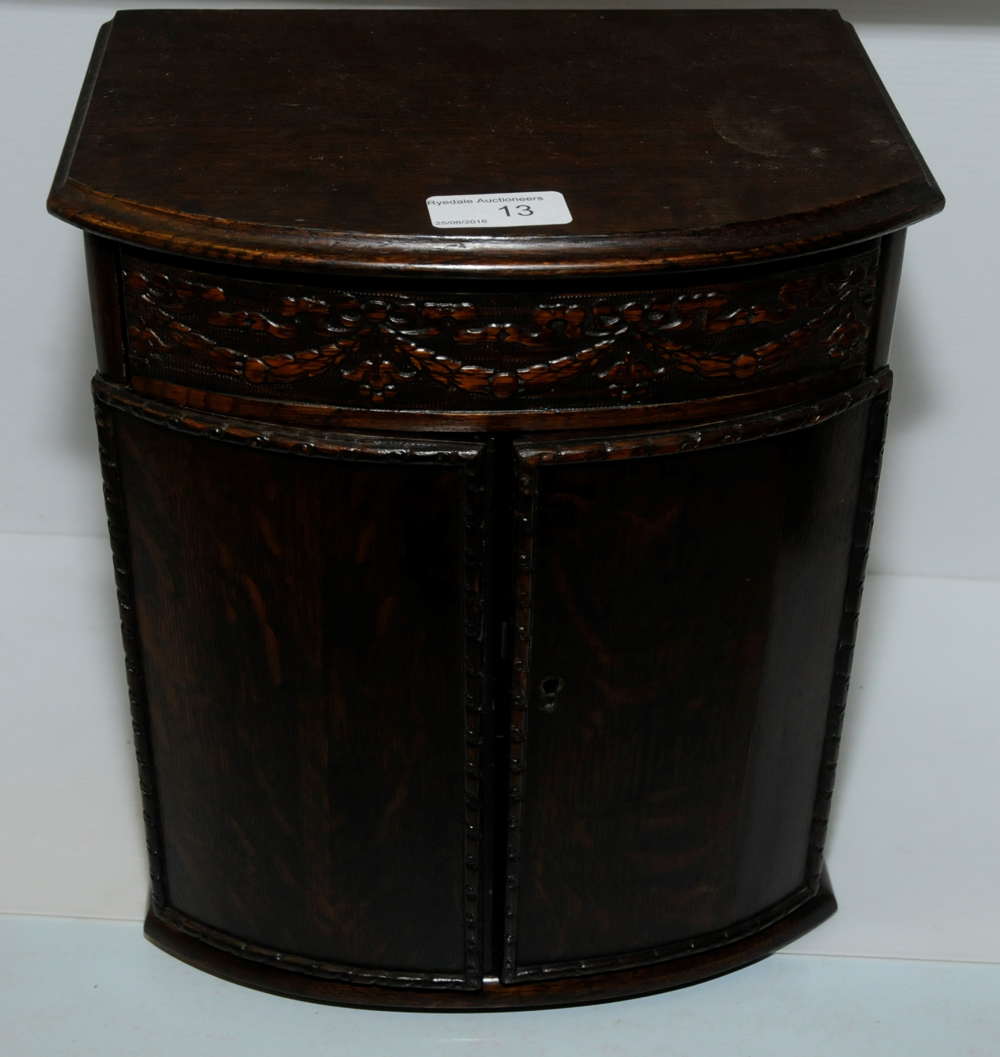 Oak smokers cabinet with internal shelf and pipe racks with upper drawer above two cupboard doors