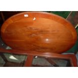 Oval tilt top yew wood coffee table