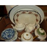 Two boxes of decorative teapots, meat plates etc.