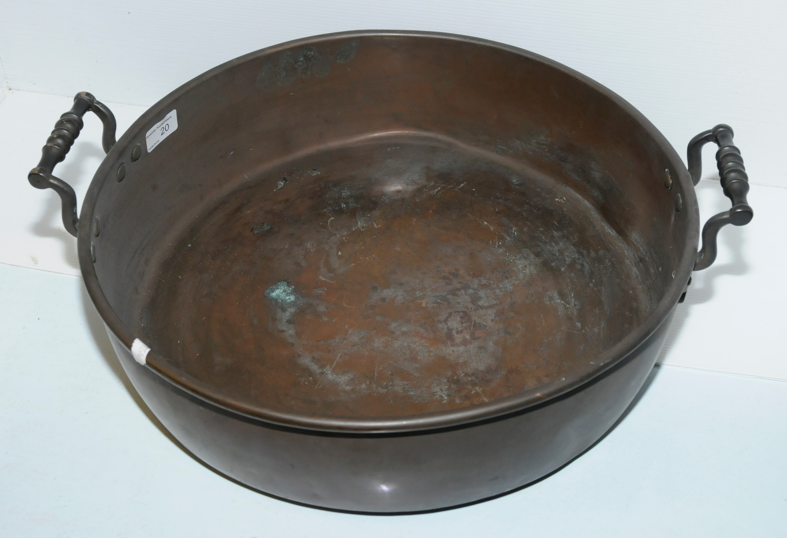 Large shallow copper dish with twin handles