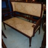 Art Nouveau mahogany inlaid three piece suit comprising of wing back sofa with upholstered seat and