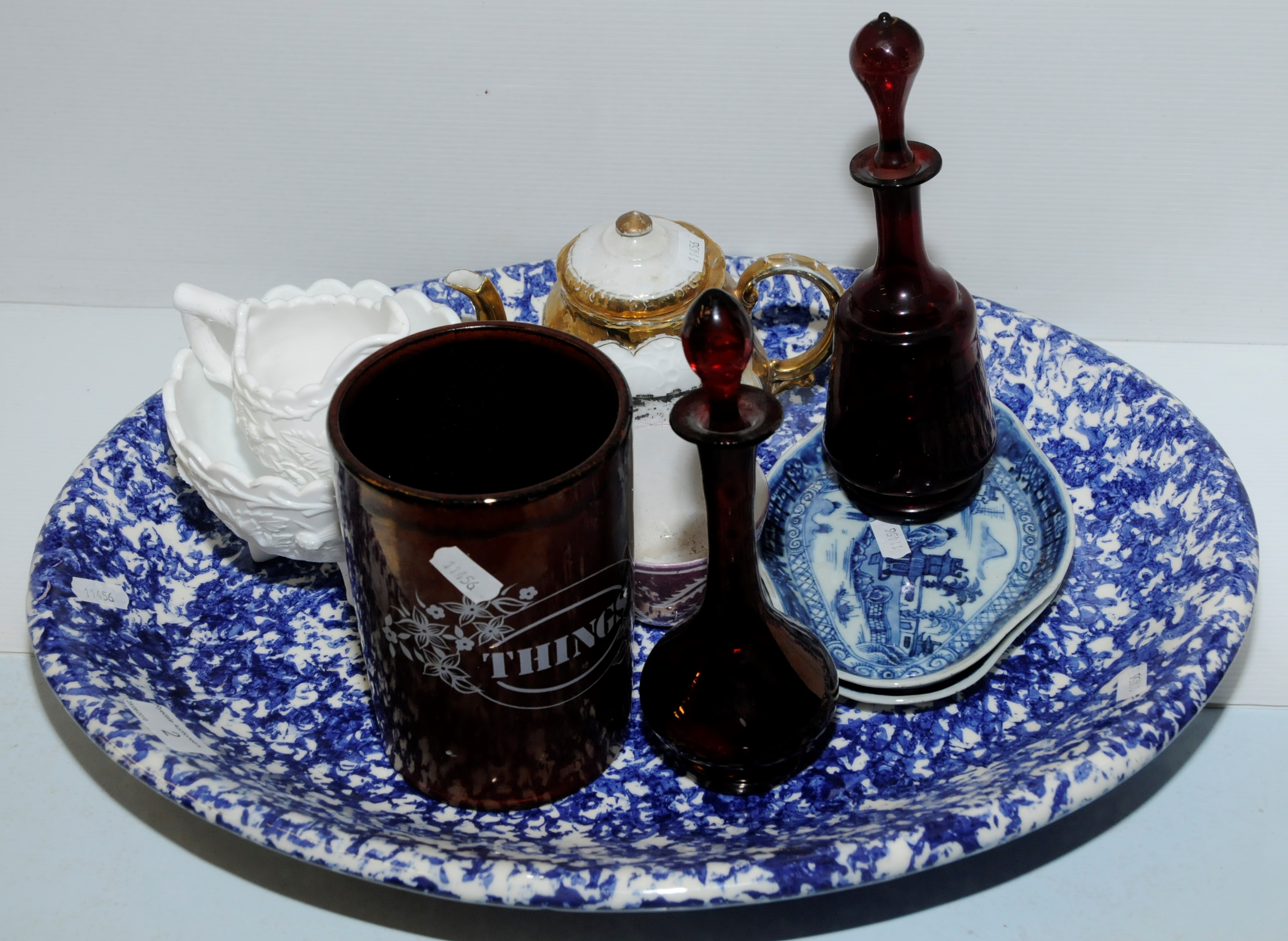 Large blue and white meat plate, two ruby glass decanter, souvenir teapot 'Long Stands Tynemouth',