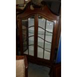 Edwardian mahogany in laid display cabinet with swan neck pediment above two glazed doors and two