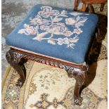 Carved mahogany dressing table stool with wool work top on ball and claw feet