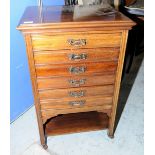 Edwardian mahogany music cabinet with six fall front drawers and under tier