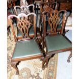 Set of four mahogany Chippendale style dining chairs with drop in seats and ball and claw feet