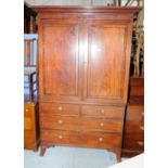 19th C mahogany and ebony inlaid linen press with two panelled cupboard doors above two short and