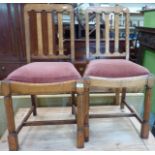 Pair of 1930s oak dining chairs with drop in upholstered seats