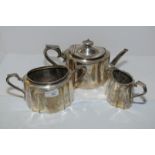 Three piece silver plated tea set with bright cut engraving