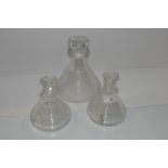 Large ribbed glass decanter and two smaller matching decanters