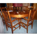 Pine oval extending dining table and a set of six (4+2) dining chairs