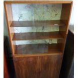 1930s display cabinet with three shelves behind glass sliding doors and two cupboard doors