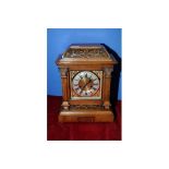 Carved walnut cased mantel clock, brass