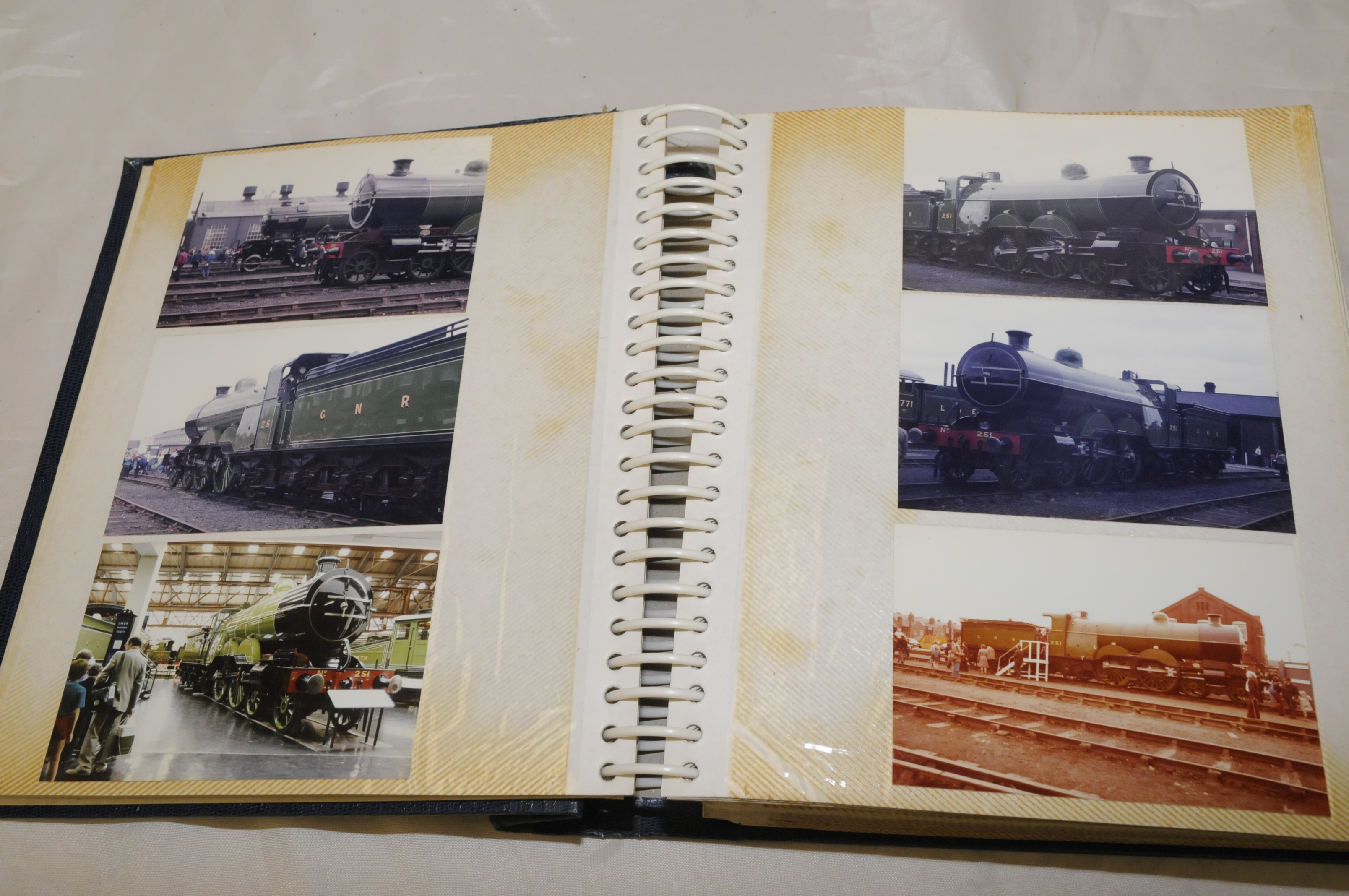 Album containing a large quantity of mostly coloured photographs of various tanks and locomotives