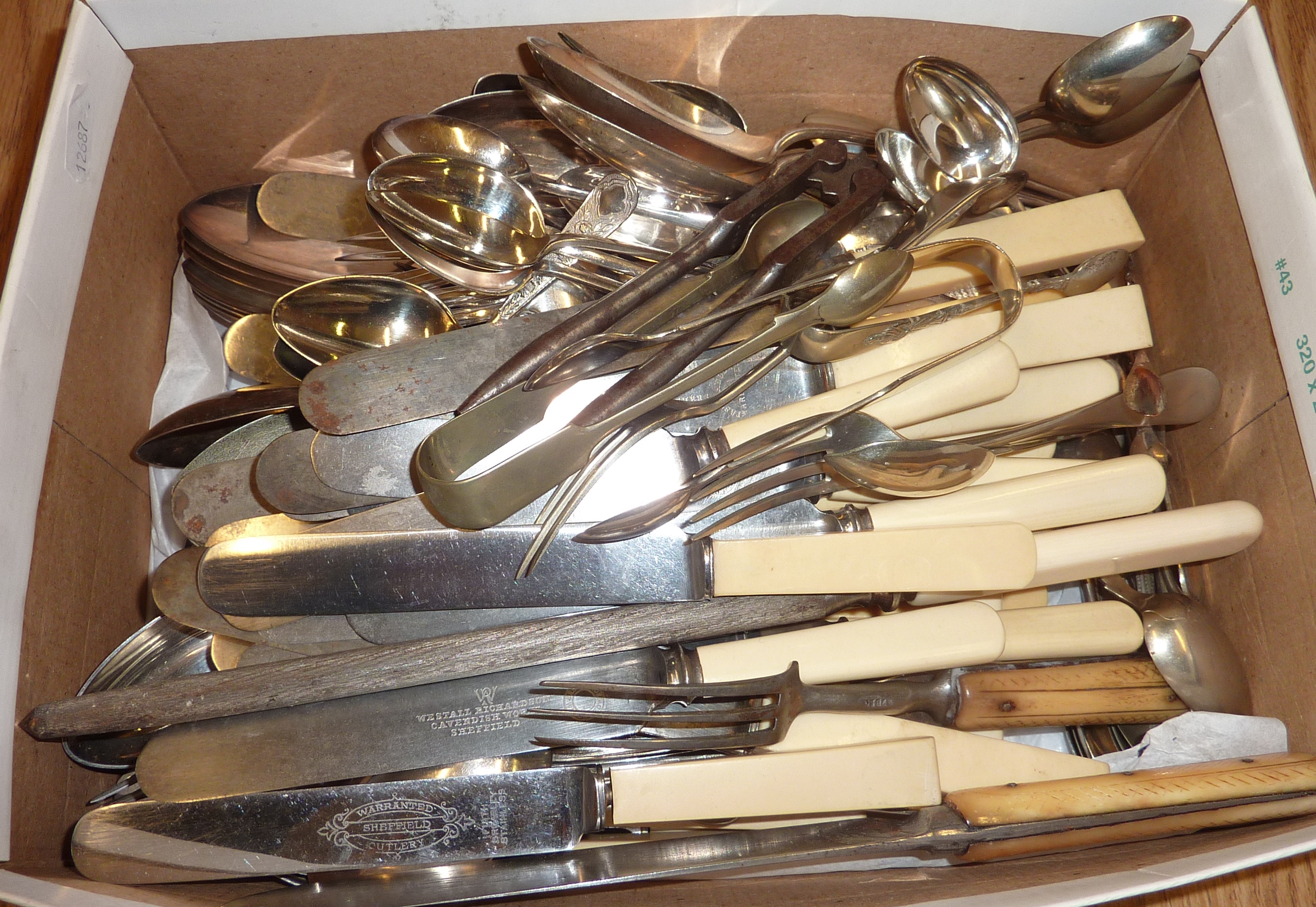 Selection of cutlery, sugar tongs etc.