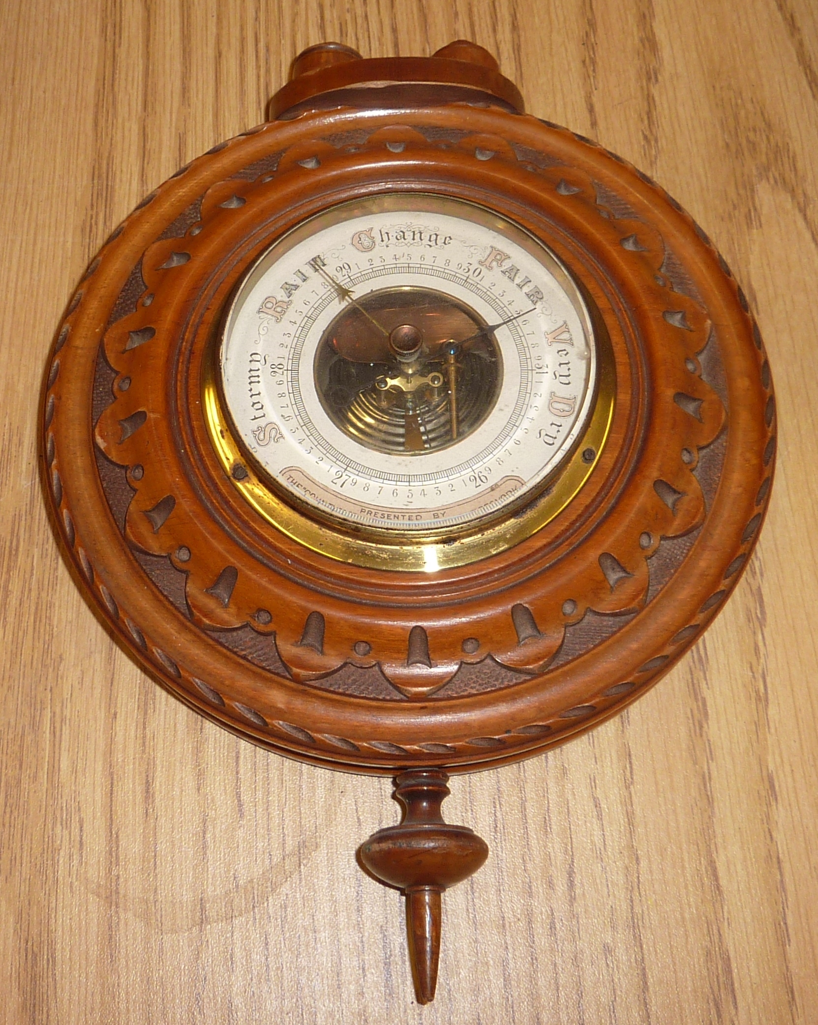 Satinwood barometer with carved border 'Presented By The County And farmers Insurance Offices York