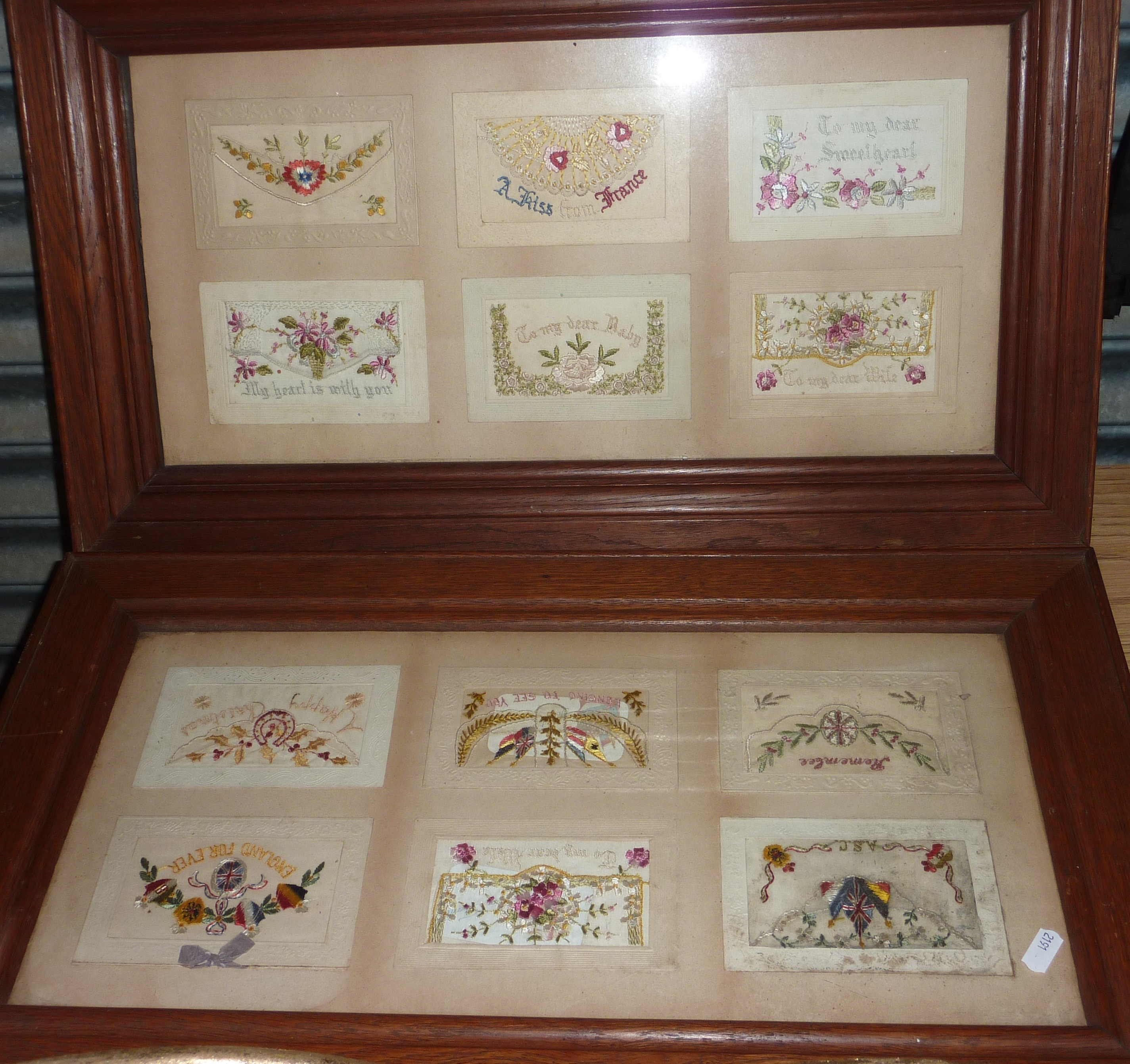 Two framed oak framed sets of 6 WWI period needlework cards