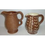 20th C slip ware jug with cream trailed slip decoration and Scottish Govancroft stoneware jug with