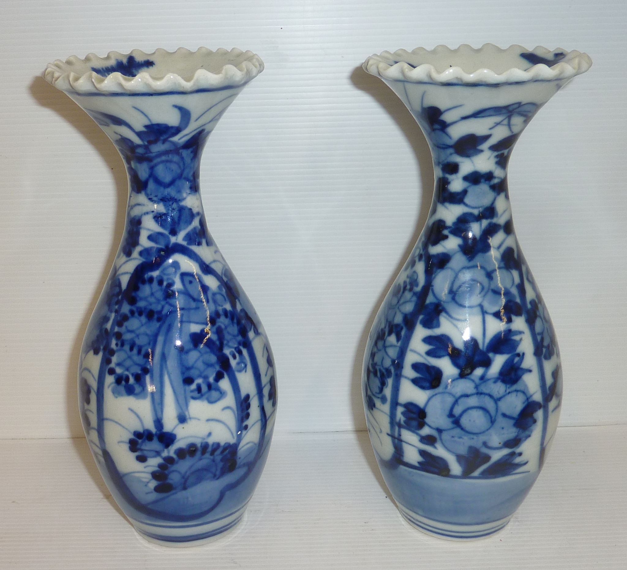 Pair of blue and white Oriental vases with frilled rim
