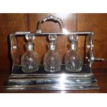 Small silver plated three bottle Tantalus