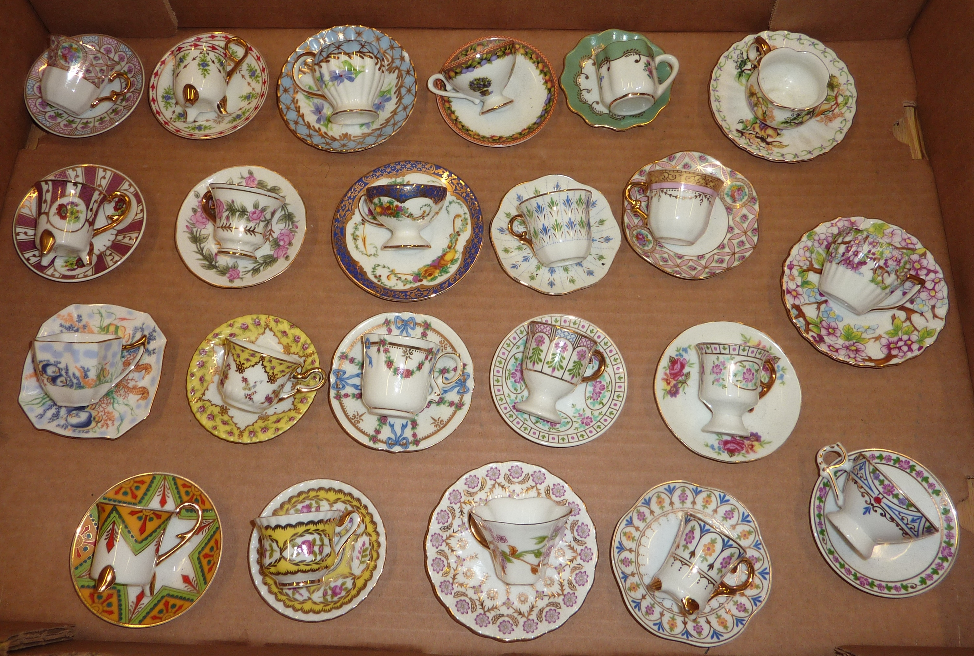 Selection of Mayfair Museum Of Miniatures cups and saucers