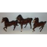 Three Beswick prancing horses