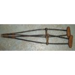 Vintage pair of wooden crutches with leather supports