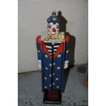 Painted wood shelf unit in the form of a clown with twin doors