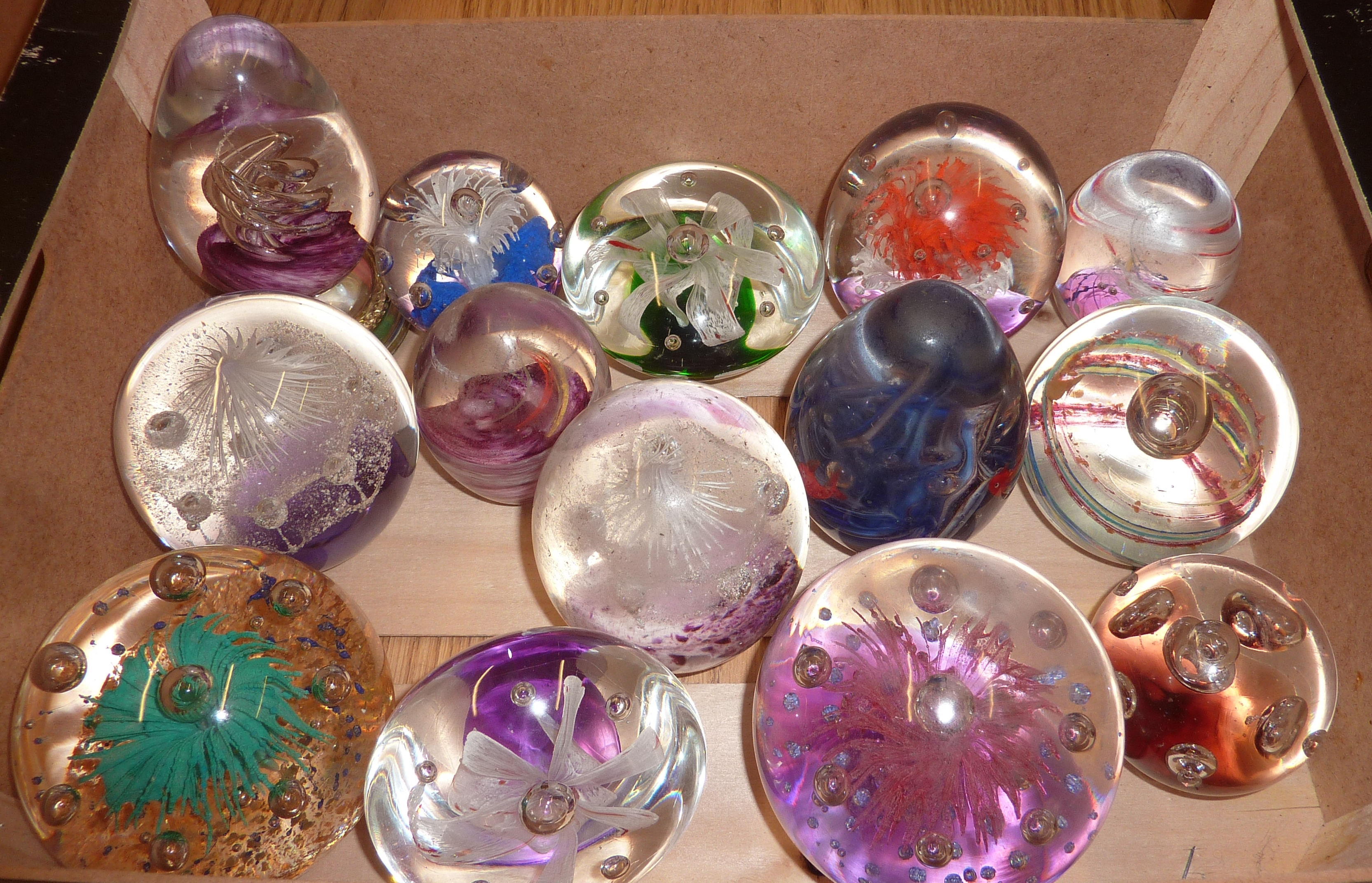 Box of assorted glass paperweights