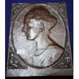 Early 20th C bronze panel the central head and shoulder portrait profile of a young lady with