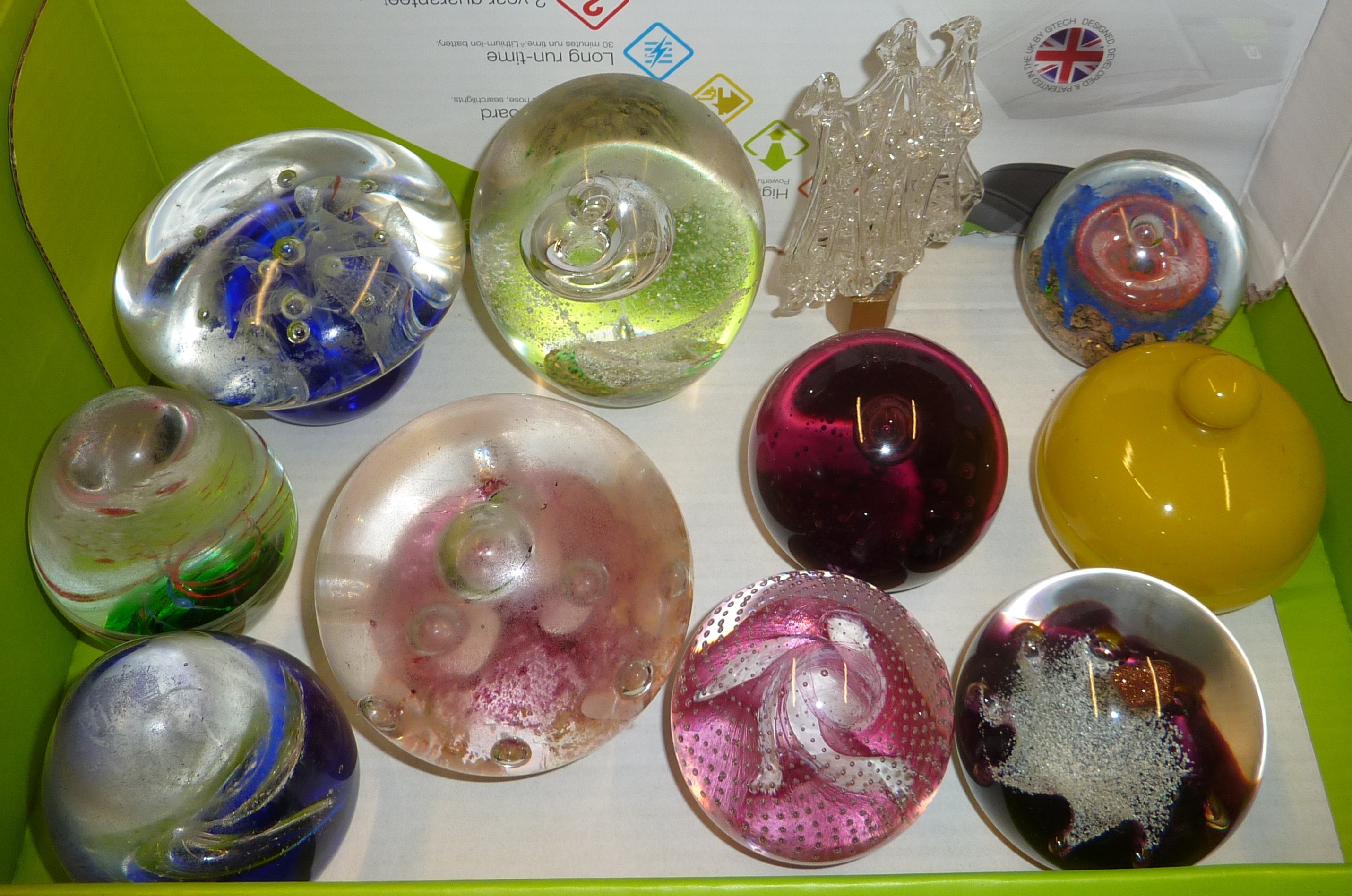Assorted glass paperweights including Caithness and an opaque glass lidded trinket pot,
