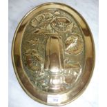 Oval brass wall plaque with embossed detail of flowers in vase (29cm x 38cm)