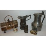 Two pewter jugs, small pewter measure,