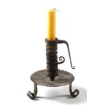 Property of a lady - a good wrought iron spiral or coil candlestick, 18th century, with petal base &