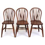 Property of a lady - three late Victorian elm seated stick-back kitchen chairs, each stamped to rear