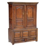 Property of a lady - a late 18th century George III oak press cupboard, 52.25ins. (133cms.) wide (