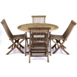 Property of a lady - a Gloster teak circular folding garden table; together with four chairs (5) (