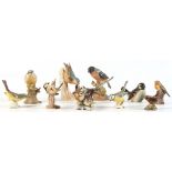 Property of a deceased estate - a collection of eleven pottery & porcelain bird figures including