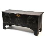 Property of a deceased estate - a 17th century carved oak six plank coffer or sword chest, with