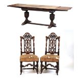 Property of a lady - an early 20th century Jacobean style carved oak draw-leaf dining table with