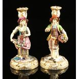 A pair of late 19th / early 20th century Derby style porcelain figural candlesticks, damages &