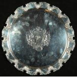 Property of a lady - an Edwardian silver salver or waiter, with 'C'-scroll & leaf border, makers