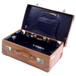 Property of a lady - an early 20th century gentleman's leather suitcase, the interior fitted with