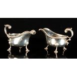 Property of a gentleman - a pair of Edwardian silver sauceboats, in the George I style, with