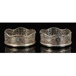 Property of a gentleman - two similar 19th century pierced silver coasters, with turned wooden