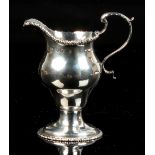 Property of a gentleman - an early George III silver helmet cream jug, with gadrooned rim, makers